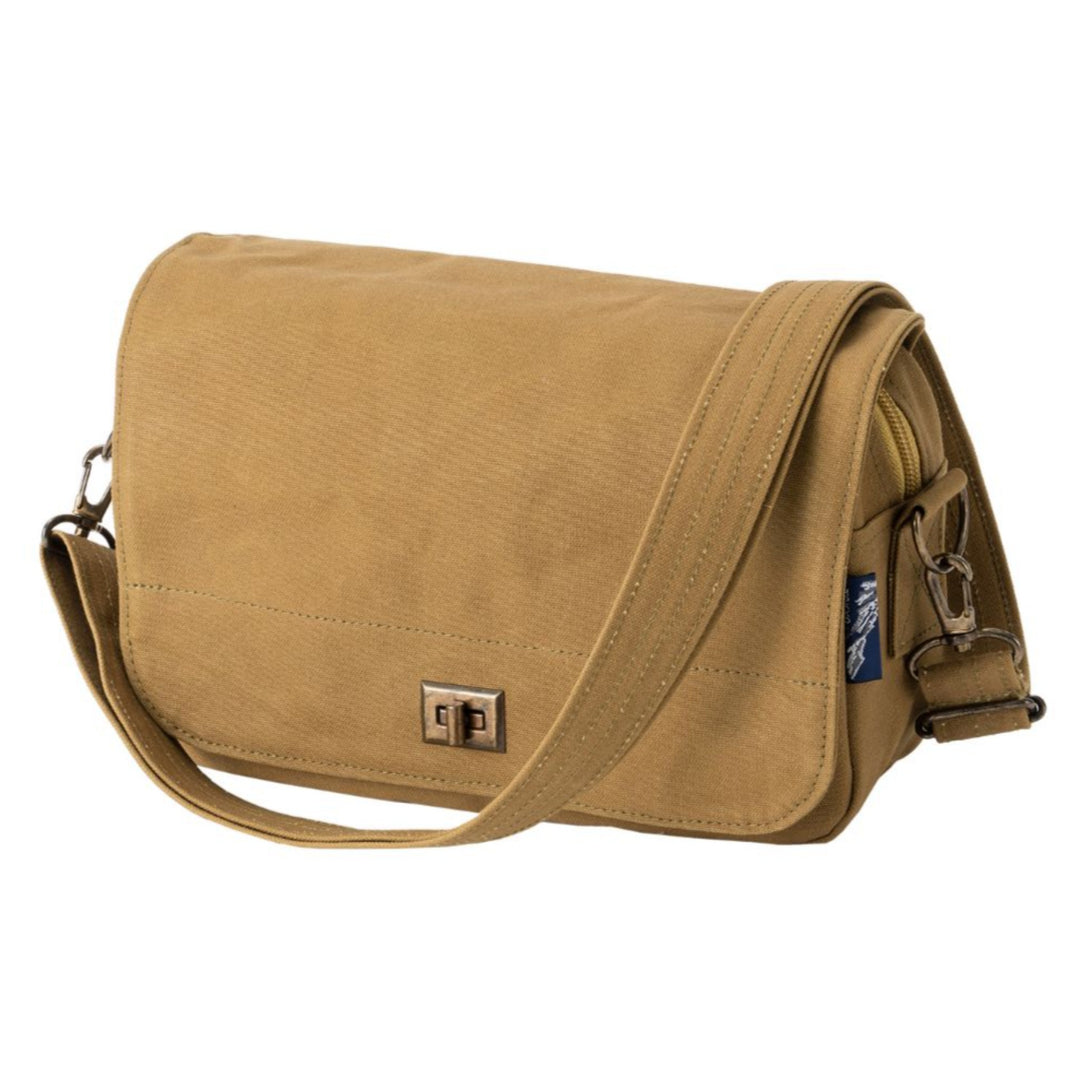 Tan canvas shoulder bag with a flap and adjustable shoulder strap
